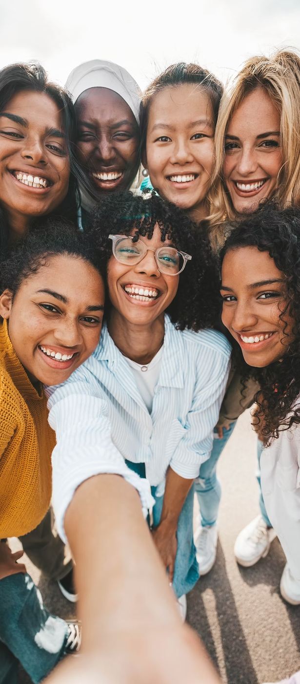 Diverse group of women smiling together