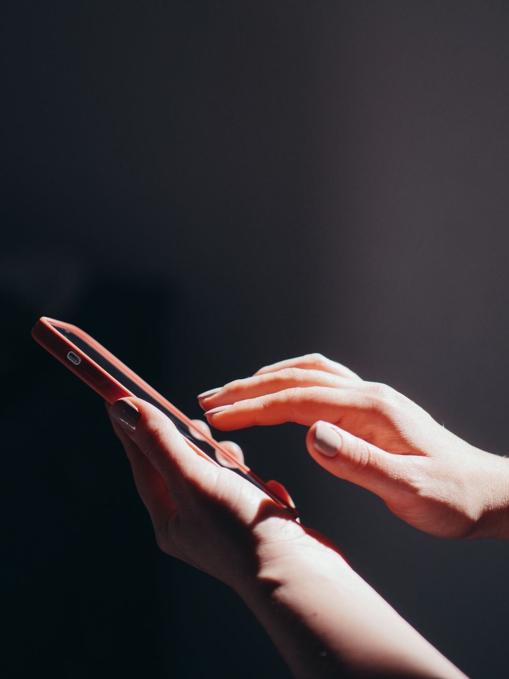 Woman reaching out to connect on her phone